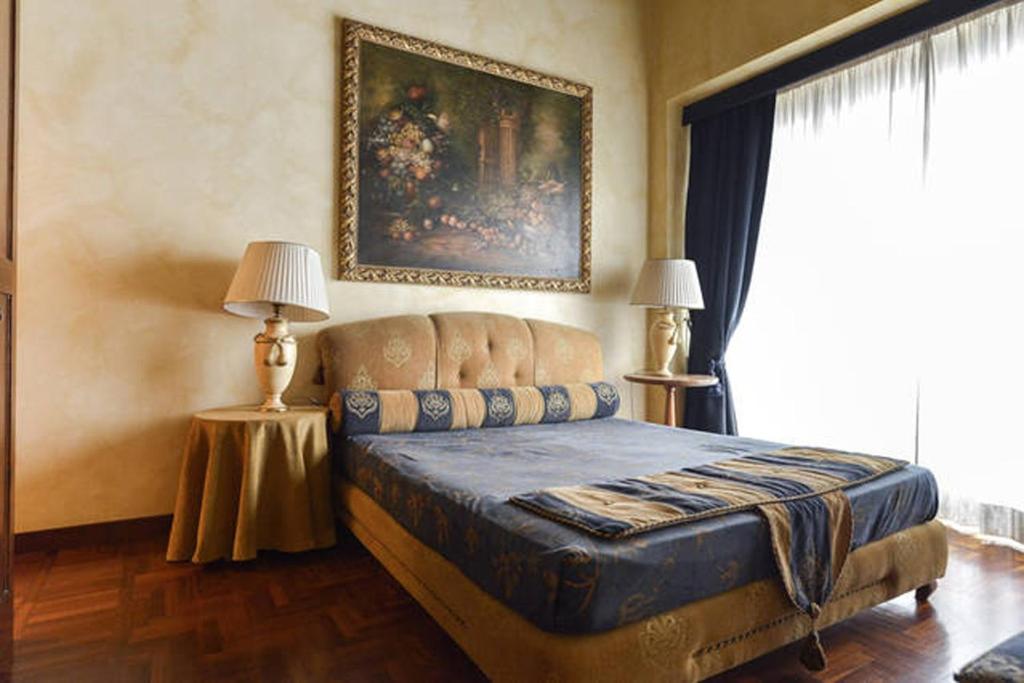 Posteľ alebo postele v izbe v ubytovaní Parione Suite Piazza Navona