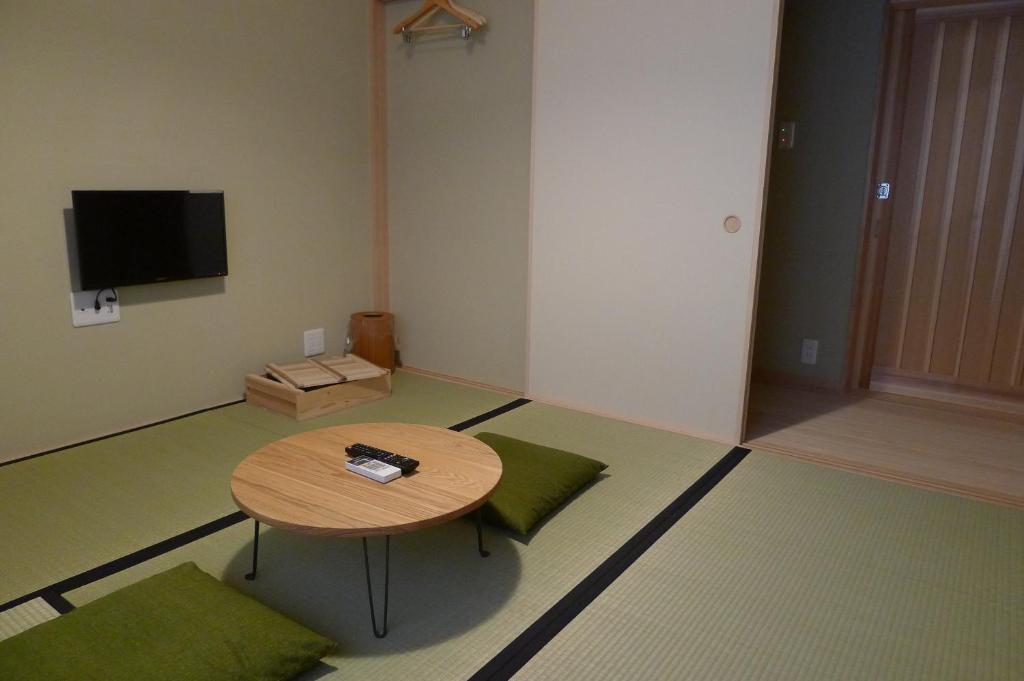 TV a/nebo společenská místnost v ubytování Luck You Kyoto