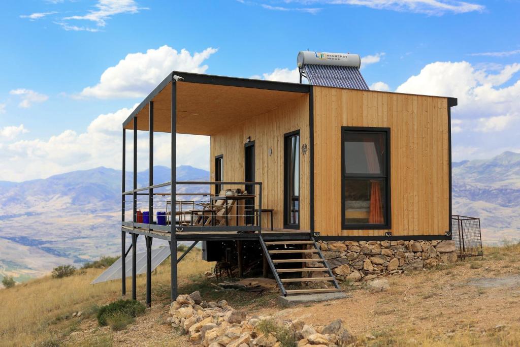 a tiny house on top of a hill at Sareni in Areni
