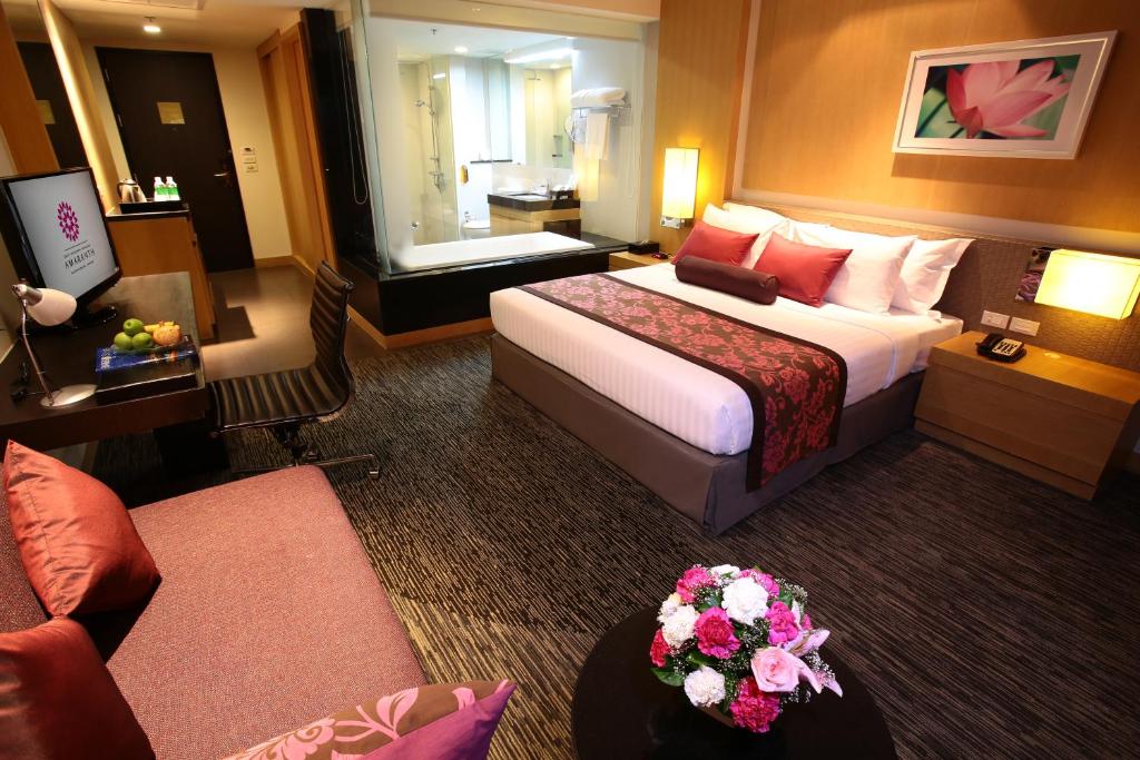 Postel nebo postele na pokoji v ubytování Amaranth Suvarnabhumi Hotel - Free Suvarnabhumi Airport Shuttle
