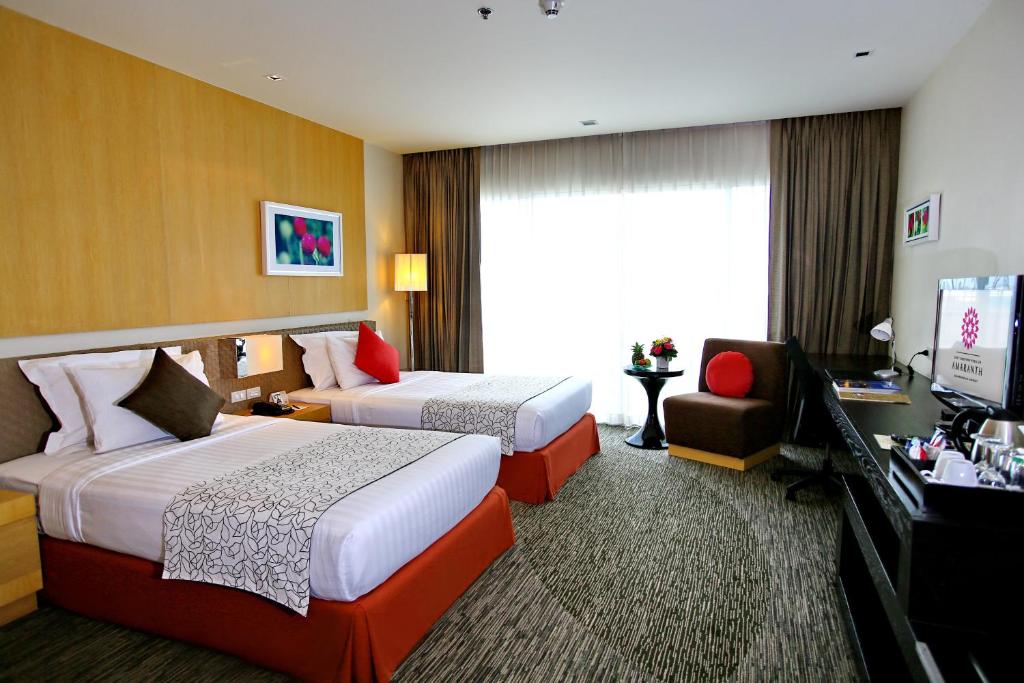 Postel nebo postele na pokoji v ubytování Amaranth Suvarnabhumi Hotel - Free Suvarnabhumi Airport Shuttle