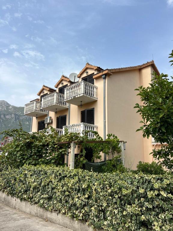 a large building with balconies on the side of it at Villa Maša in Zelenika