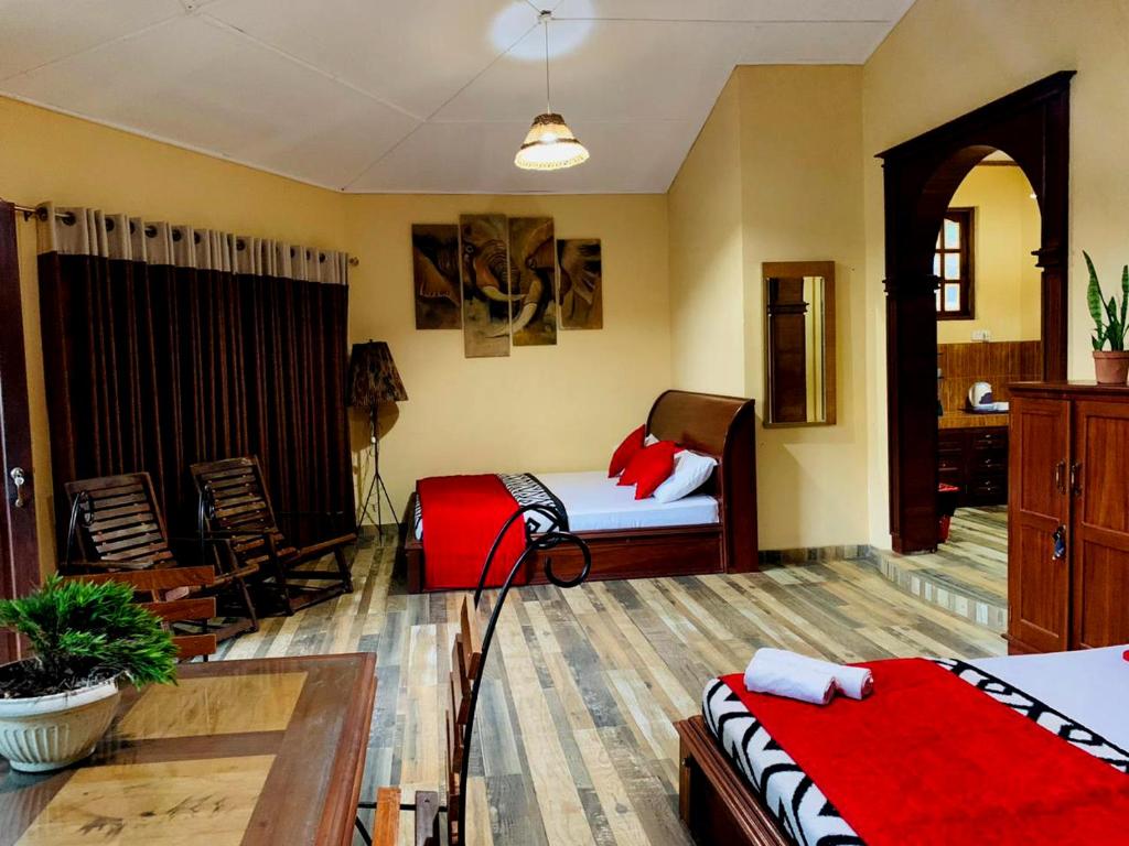 Postel nebo postele na pokoji v ubytování Diyon Holiday Bungalow