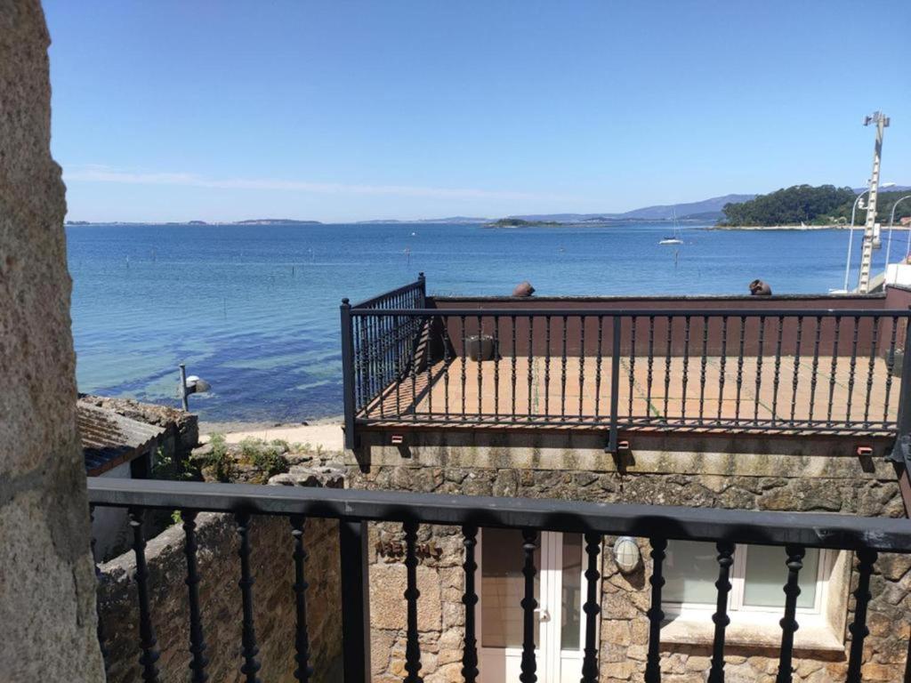 a view of the ocean from a balcony of a beach at Casa O Curruncho 3000 in Vilagarcia de Arousa