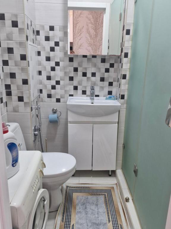 Koupelna v ubytování Квартира