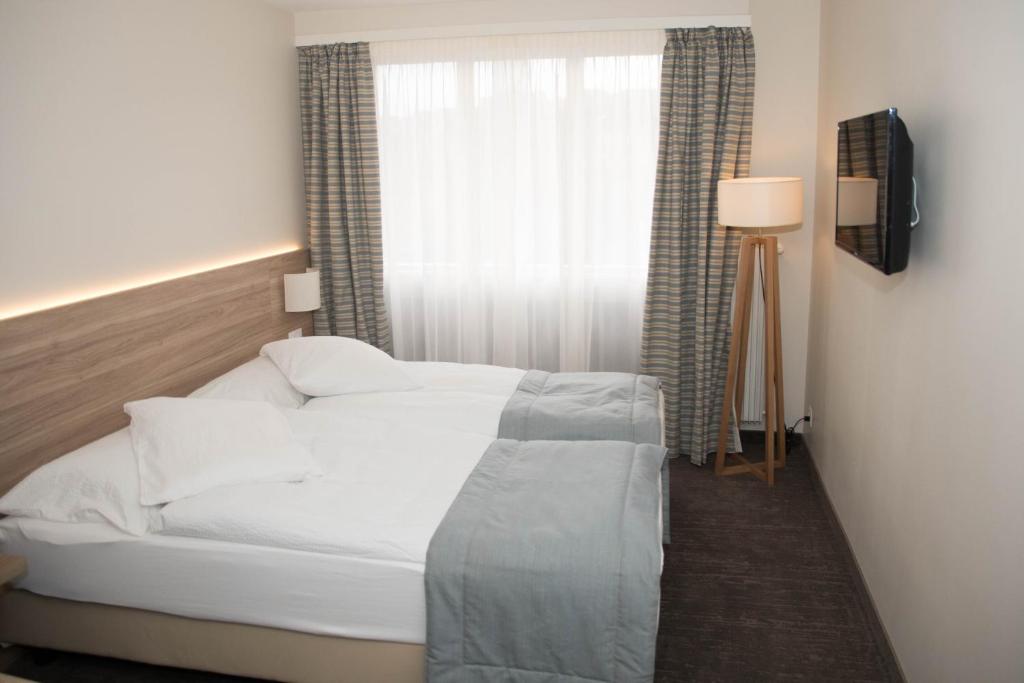 Letto o letti in una camera di Hôtel de Chailly