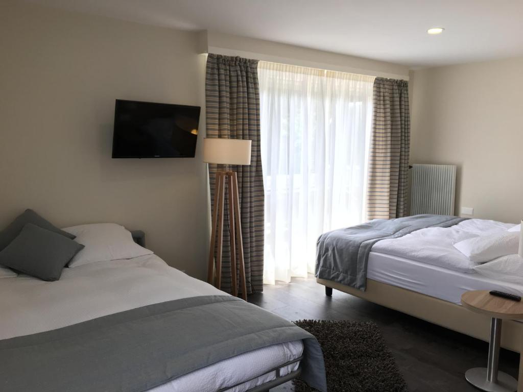 Letto o letti in una camera di Hôtel de Chailly