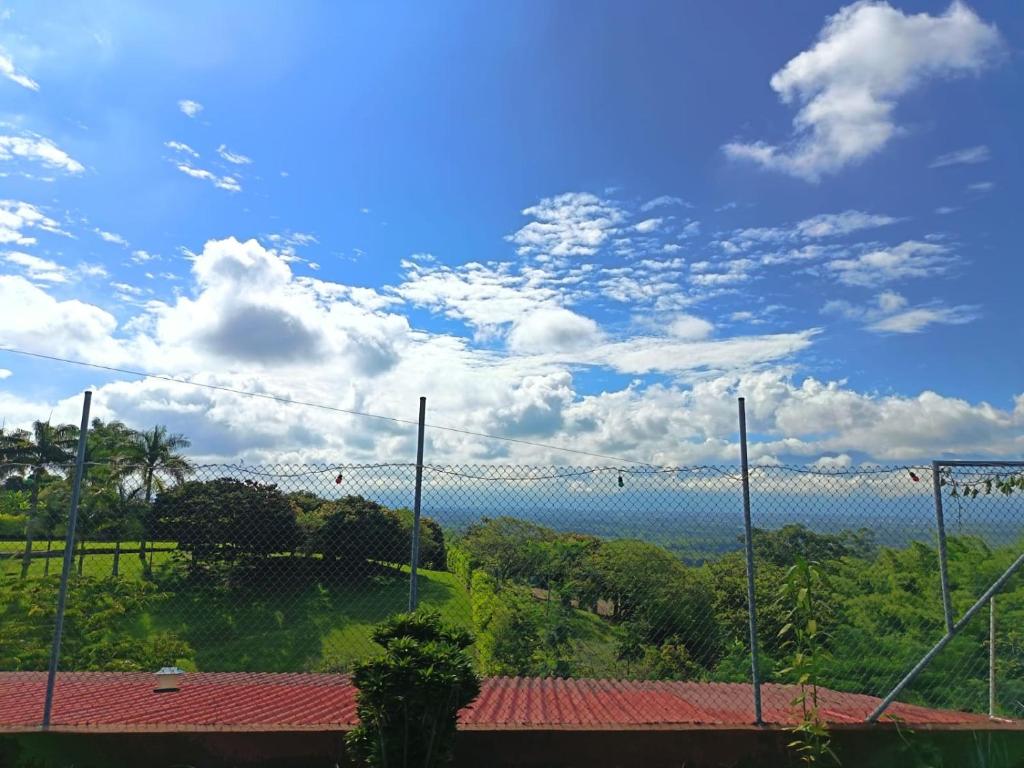 a view of the ocean from behind a fence at la colombiana casa campestre in Quimbaya