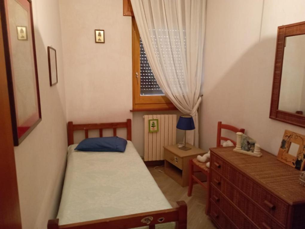 Ένα ή περισσότερα κρεβάτια σε δωμάτιο στο Casa Checco