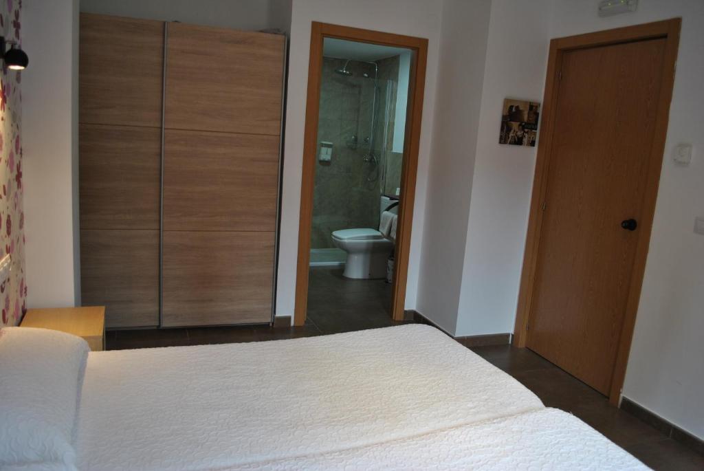 Postel nebo postele na pokoji v ubytování Hostal la Catedral