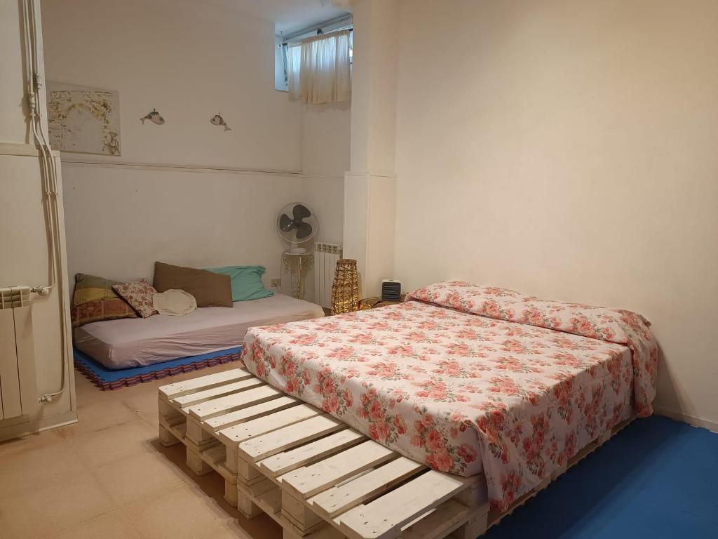 Ένα ή περισσότερα κρεβάτια σε δωμάτιο στο Taverna Sport