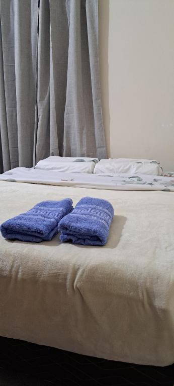 Giường trong phòng chung tại Casa familiar cómoda