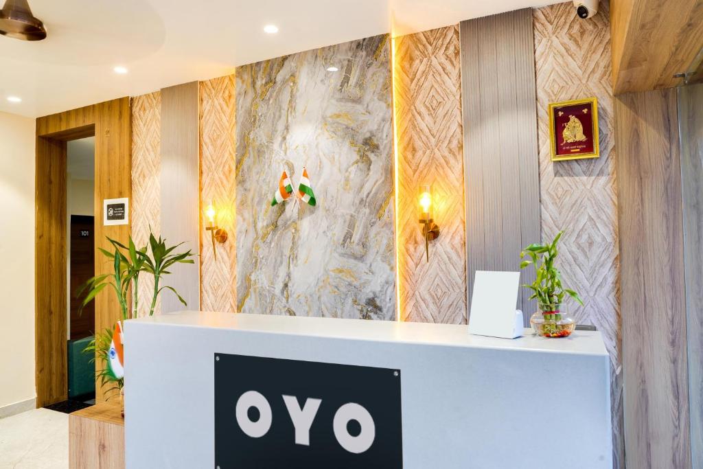 aiya sign on a counter in a lobby at HOTEL O ANJANEY PALACE in Bhopal