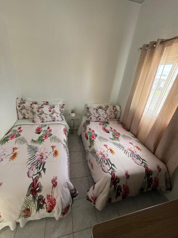 En eller flere senge i et værelse på Tu refugio a pasos del centro comercial