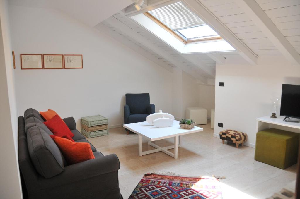 a living room with two couches and a table at Casa Sant Anna in Pordenone