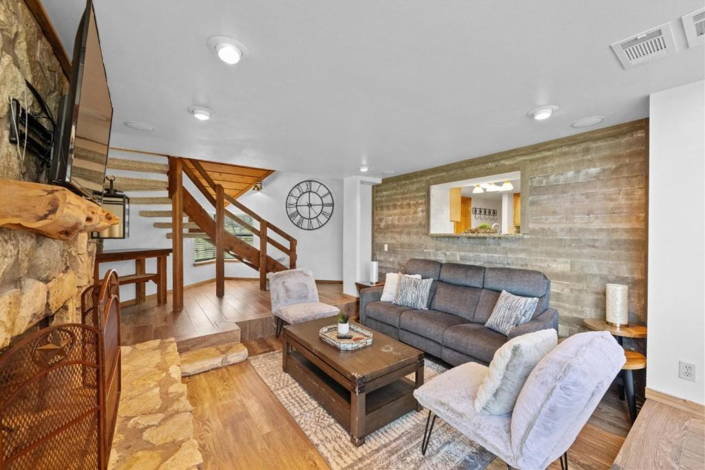 a living room with a couch and a table at The Cozy Corner in Windermere Oaks on Lake Travis in Spicewood