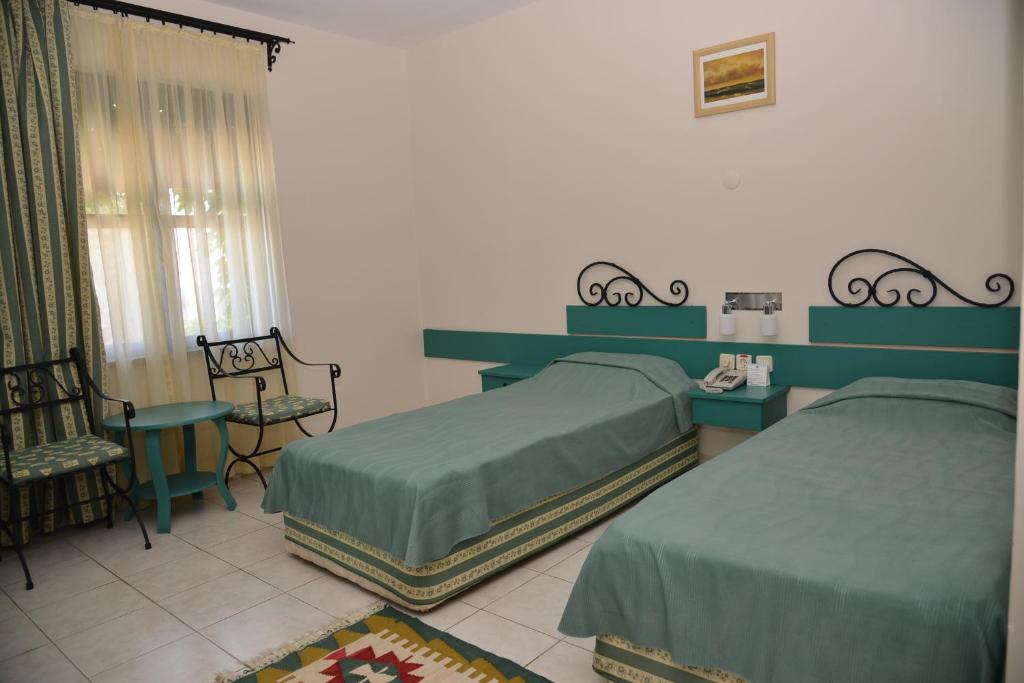Postel nebo postele na pokoji v ubytování Titan Club Hotel Ultra All Inclusive