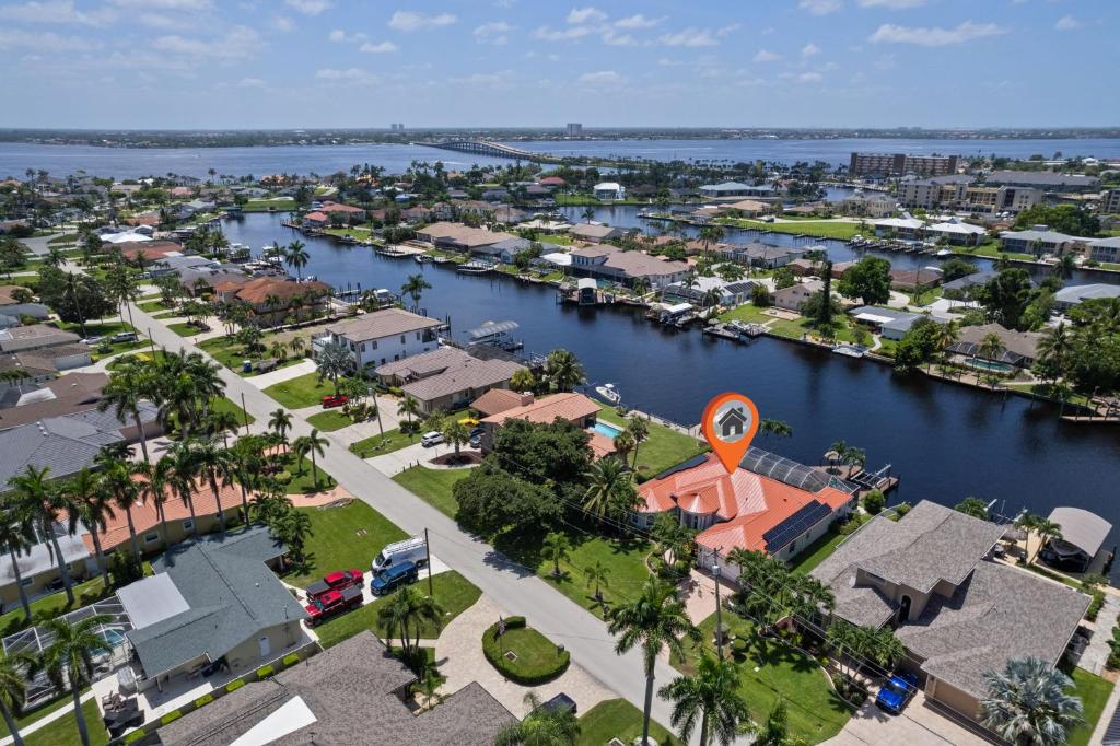 an aerial view of a city with a river at Cape Serenity- Luxury Waterfront Villa with Kayaks and Bikes in Cape Coral