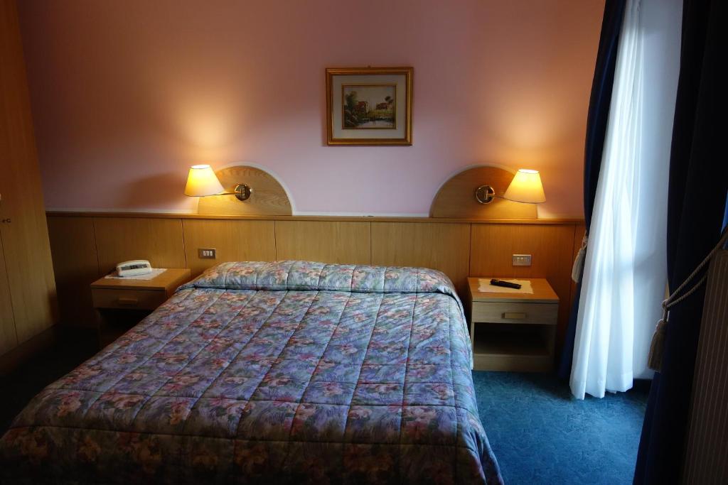 Postel nebo postele na pokoji v ubytování Alpine Touring Hotel-petfriendly