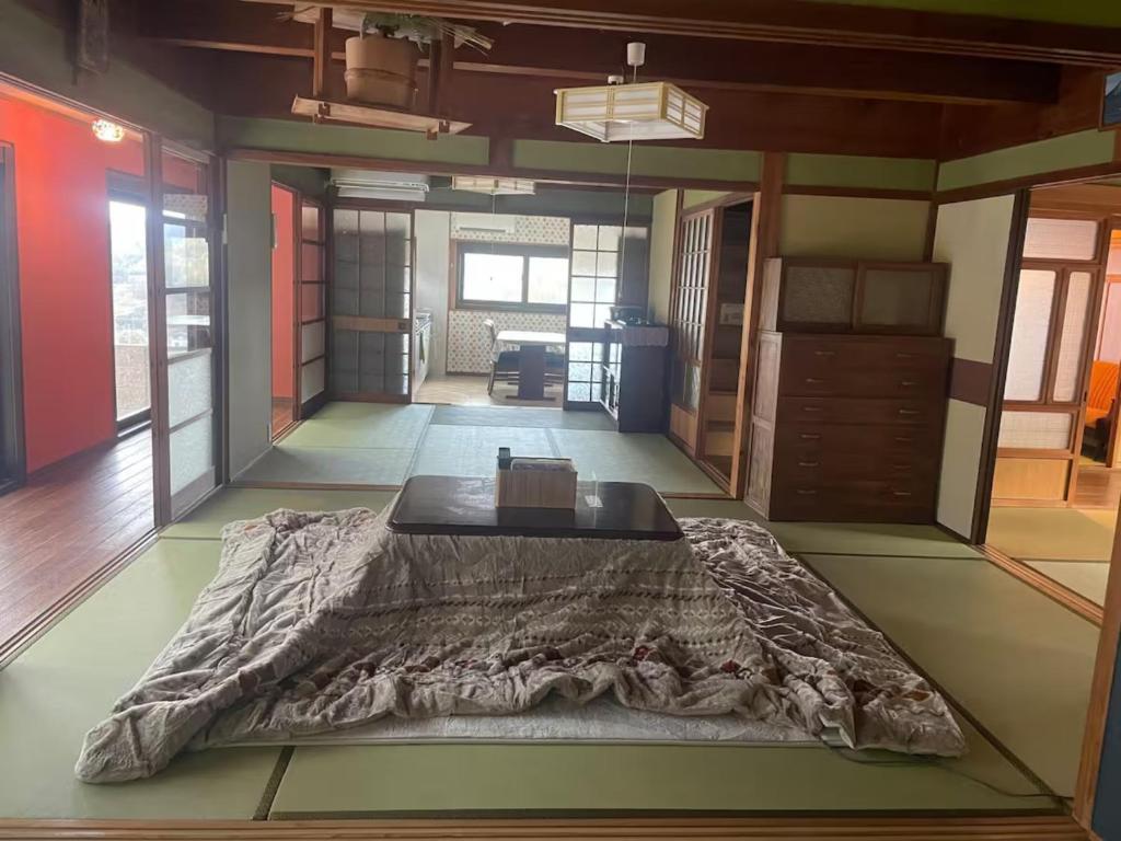 a room with a bed in the middle of a room at Grannys House - Vacation STAY 19625 in Awaji