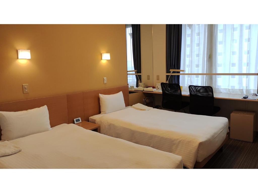 เตียงในห้องที่ Smile Hotel Sendai Tagajyo - Vacation STAY 84267v
