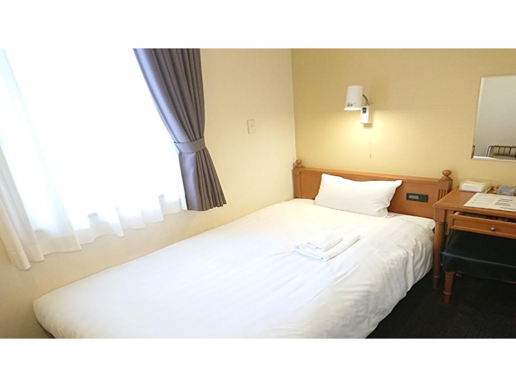 Postel nebo postele na pokoji v ubytování Smile Hotel Kobe Motomachi - Vacation STAY 85847v