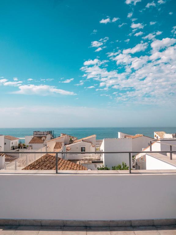 a view of the ocean from the roof of a building at El Pirata 78 in Estepona