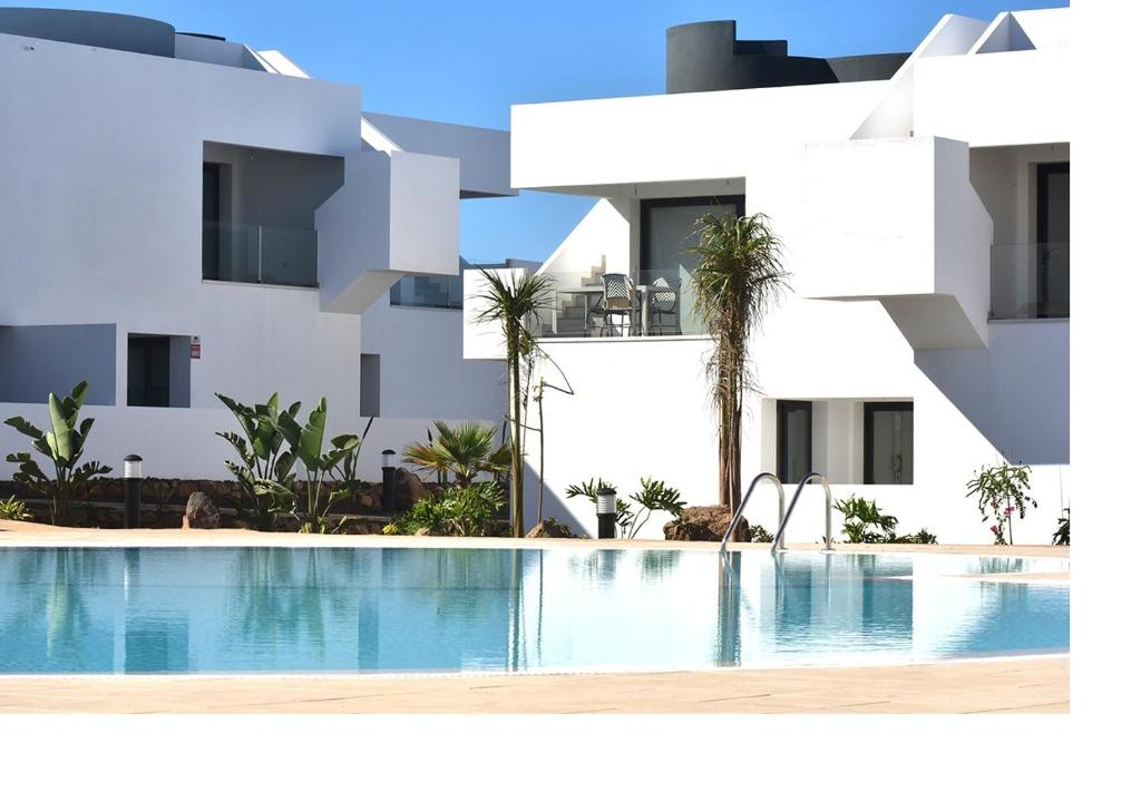 a rendering of a building with a swimming pool at Mariposa Blanca in Villaverde