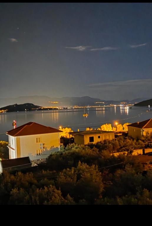 a view of a large body of water at night at Bracera Luxury Apartments in Slatine