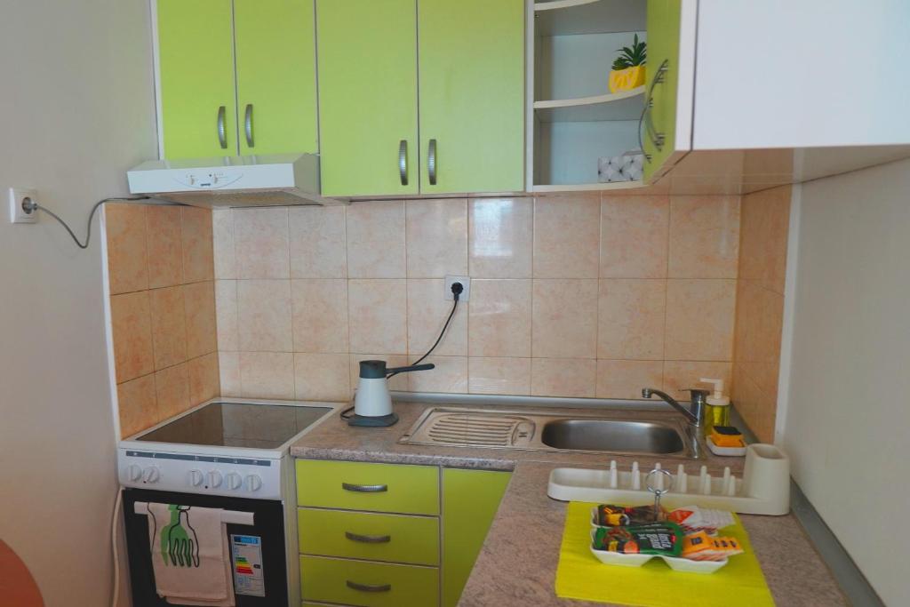 Kuchyň nebo kuchyňský kout v ubytování Nomada Apartment