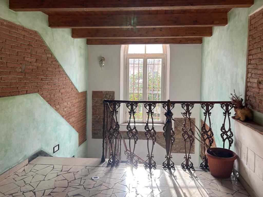 a staircase in a building with a window at Casa Claretta in Livorno