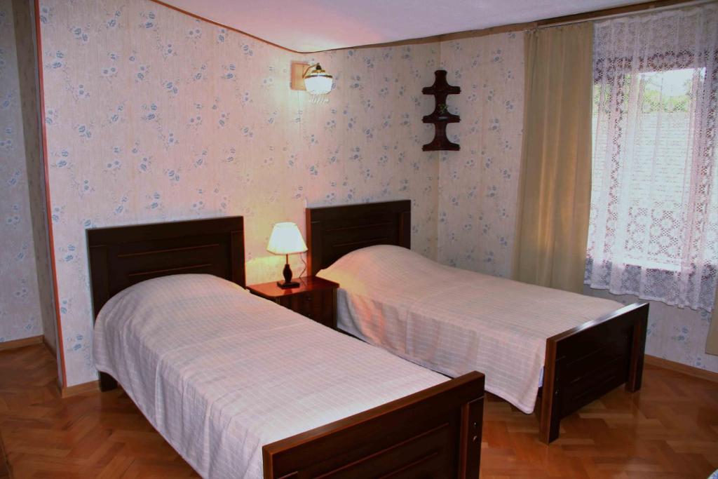Postel nebo postele na pokoji v ubytování Hotel Queen