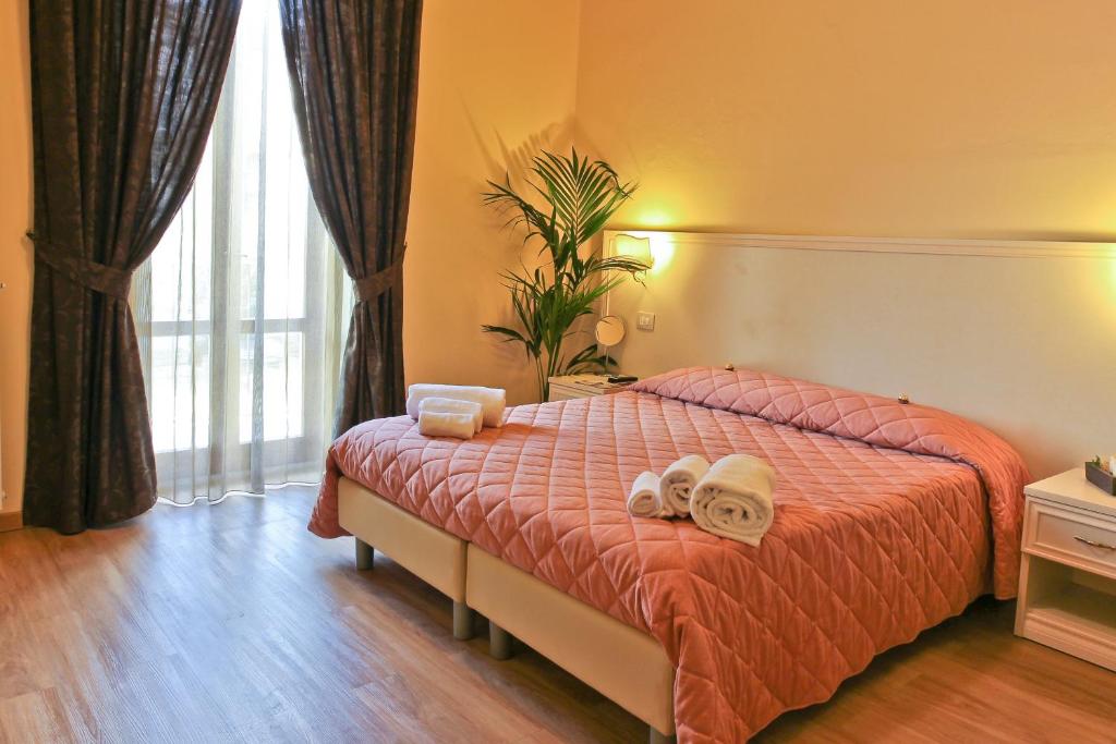 Postel nebo postele na pokoji v ubytování Hotel Il Monte