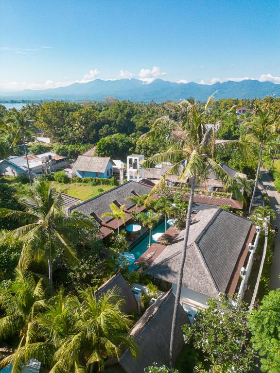 an aerial view of a resort with palm trees at Villa Tahid in Gili Islands