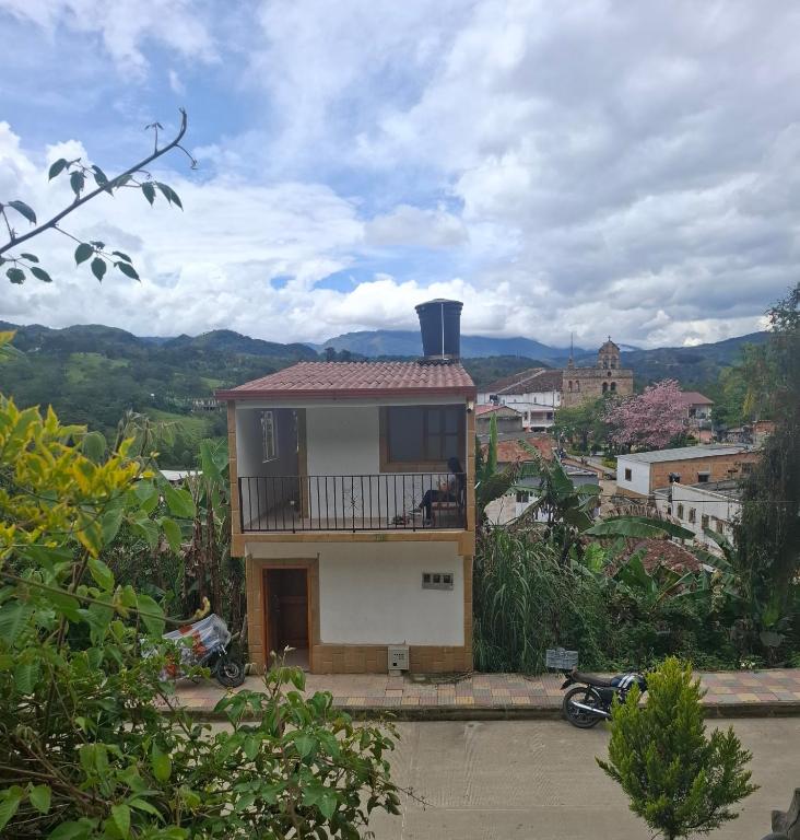 a small house with a balcony in a city at Penthouse - Altos de Iguaque in Gámbita