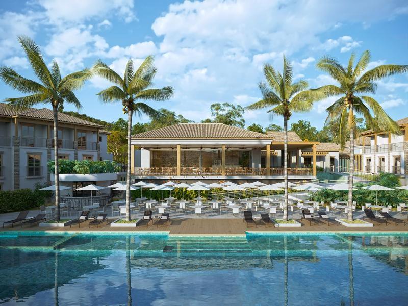 a resort with a pool and chairs and palm trees at Pyreneus Residence in Pirenópolis