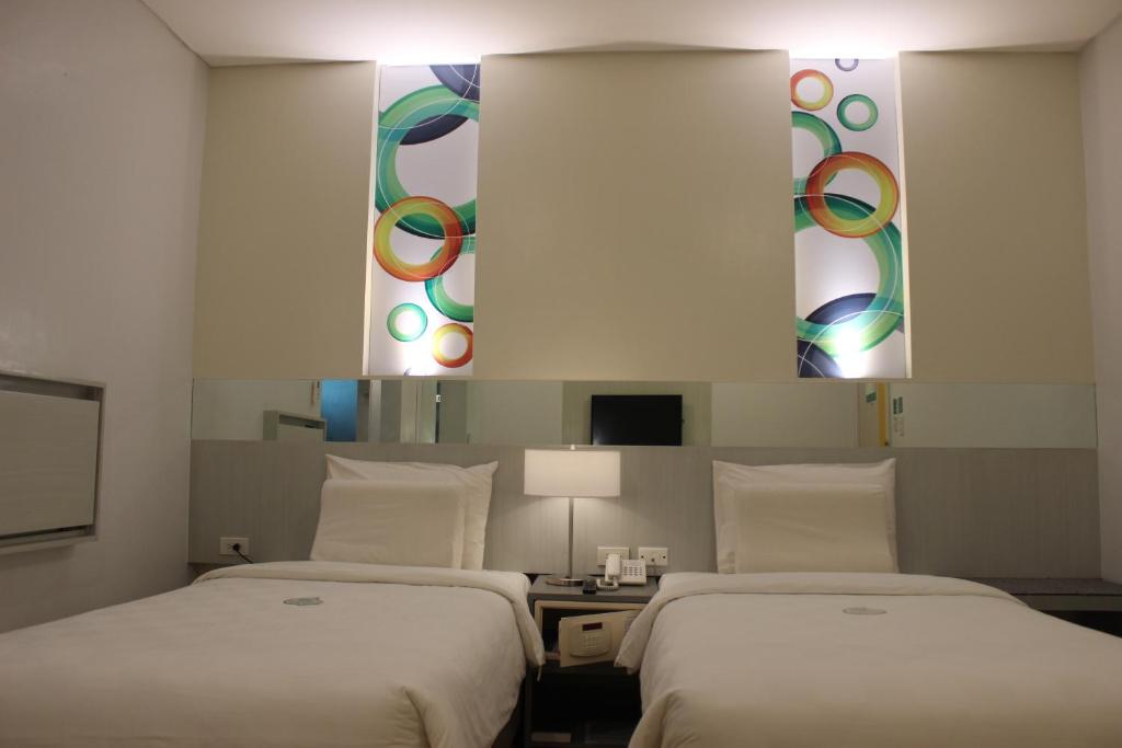 Postel nebo postele na pokoji v ubytování Go Hotels Butuan