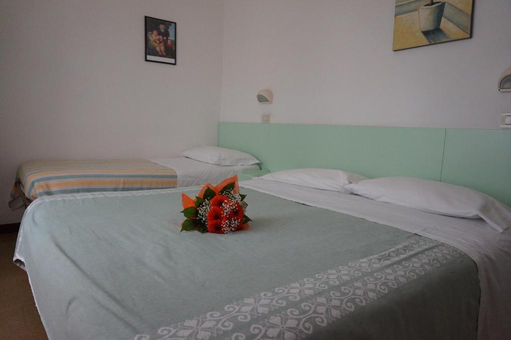 Postel nebo postele na pokoji v ubytování Hotel Aurora