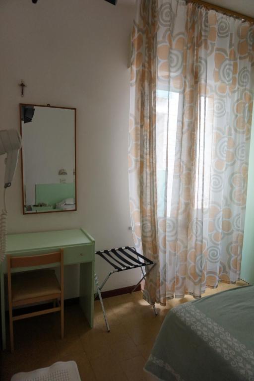 Postel nebo postele na pokoji v ubytování Hotel Aurora