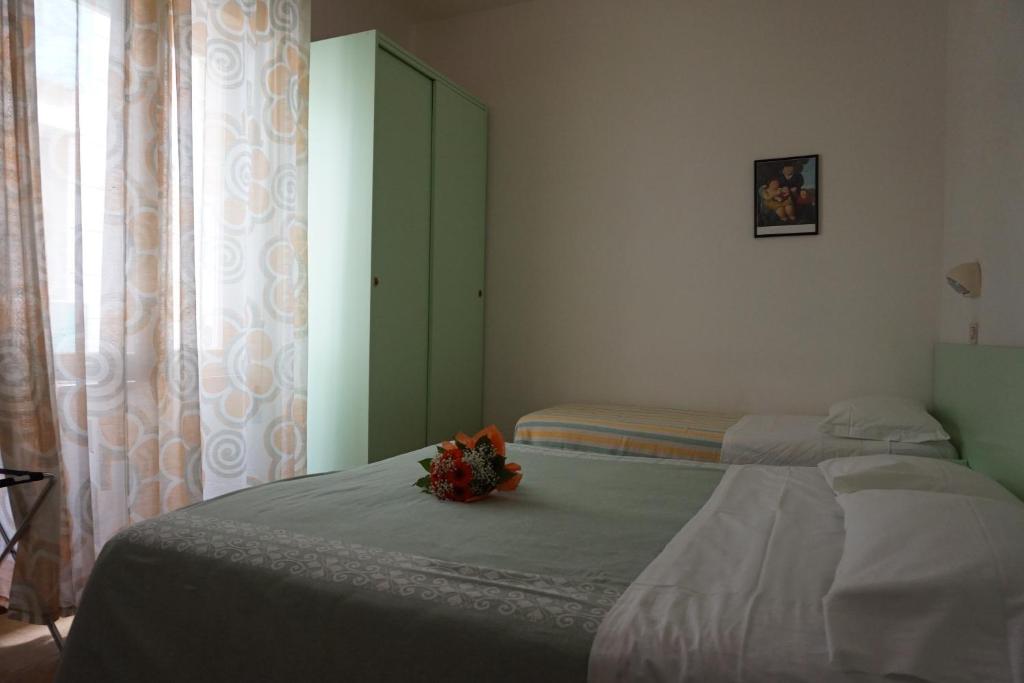 Postel nebo postele na pokoji v ubytování Hotel Aurora
