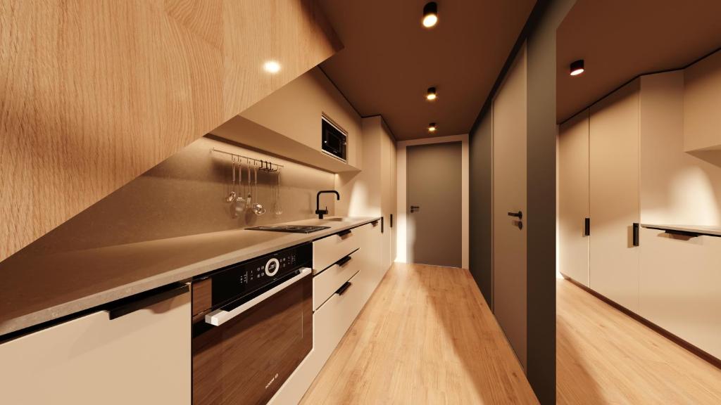 Una cocina o cocineta en Sume by Larsen