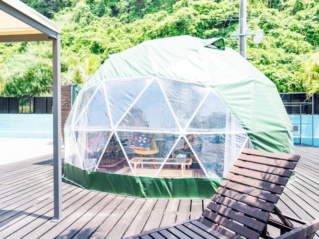 a chair and a tent on a deck at Kaamlanai Harbor - Vacation STAY 40317v in Nichinan