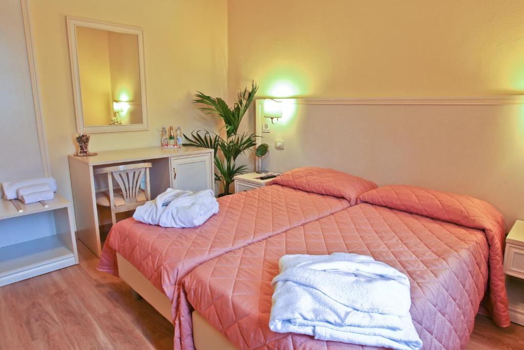 Postel nebo postele na pokoji v ubytování Hotel Il Monte