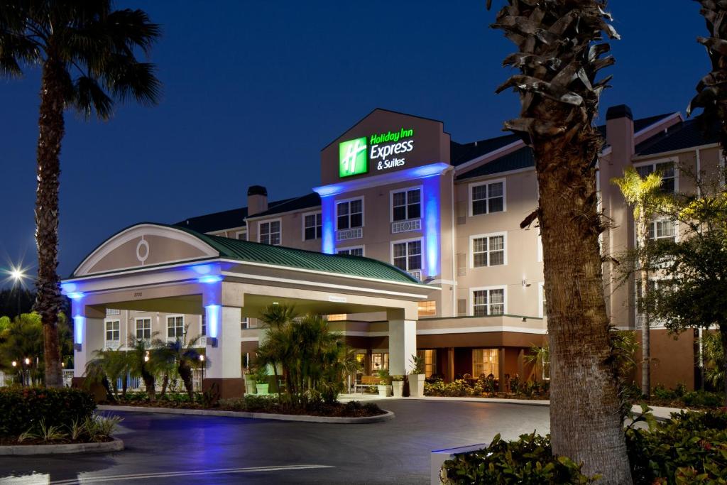 a hotel room with a palm tree in front of it at Holiday Inn Express & Suites Sarasota East, an IHG Hotel in Sarasota