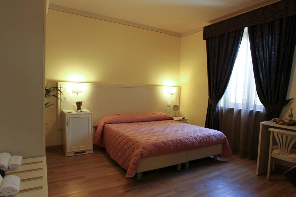 Postel nebo postele na pokoji v ubytování Hotel Il Monte