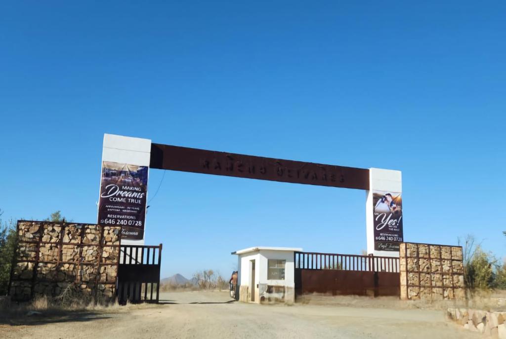 a gas station with a sign that reads ahead of the market at Villas Baja Toscana de Rancho Olivares in Ensenada