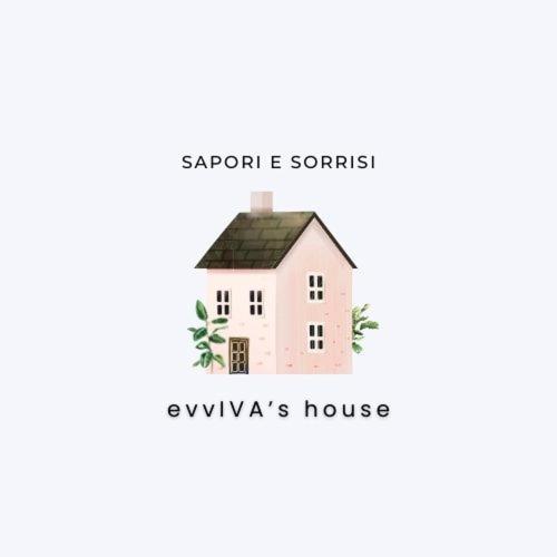 a pink house with a black roof at evvIVA's house in Osimo