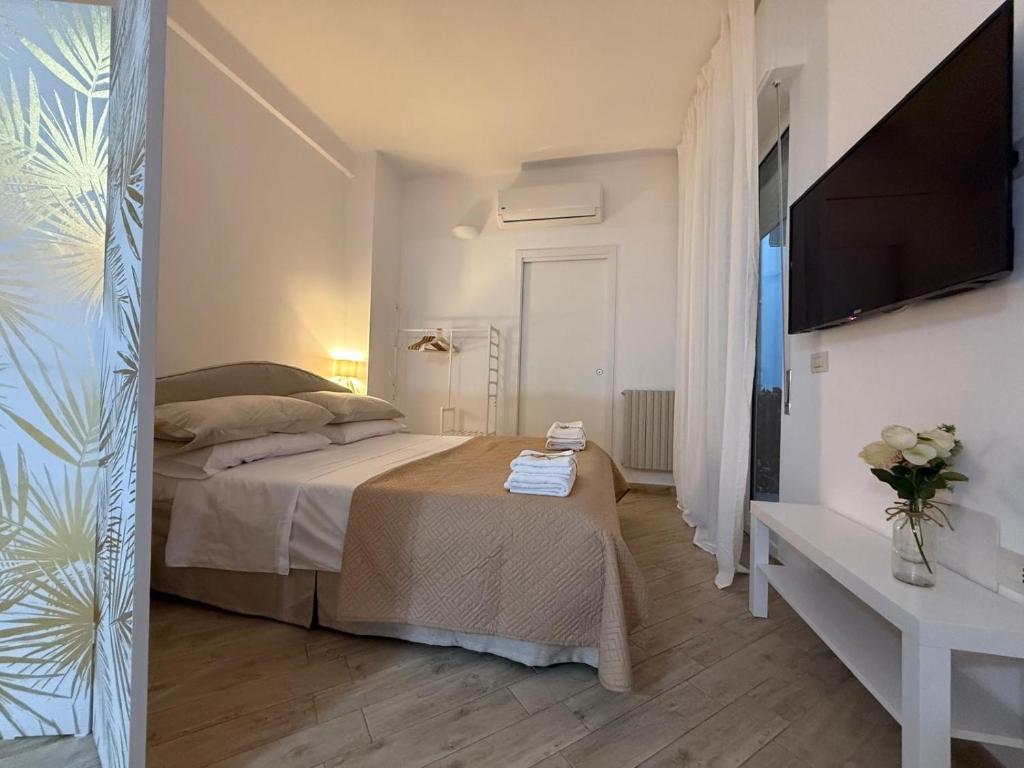 Ένα ή περισσότερα κρεβάτια σε δωμάτιο στο Dimora Magda