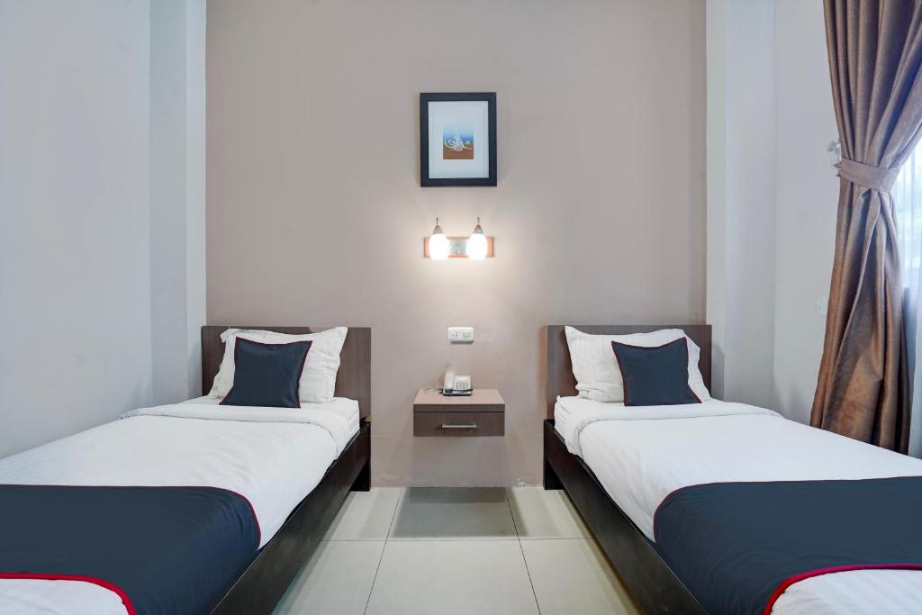 Townhouse Oak Padang near RTH Imam Bonjol - Habitación Deluxe Con 2 Camas Individuales