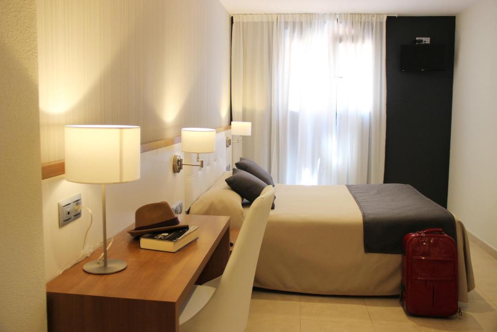 Cama o camas de una habitación en Hotel Teruel